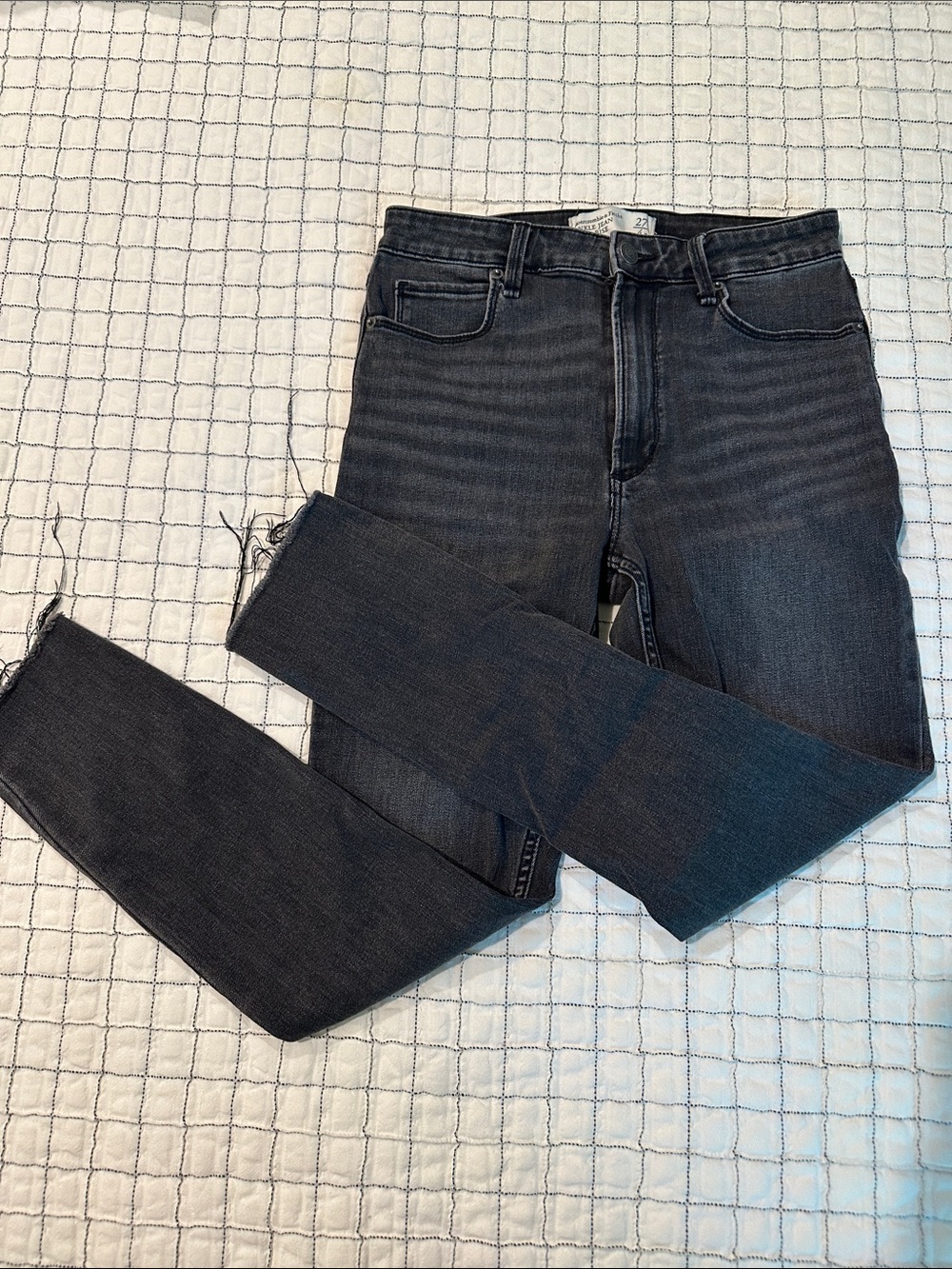 Women’s Faded Black Skinny Jeans with Raw Hem